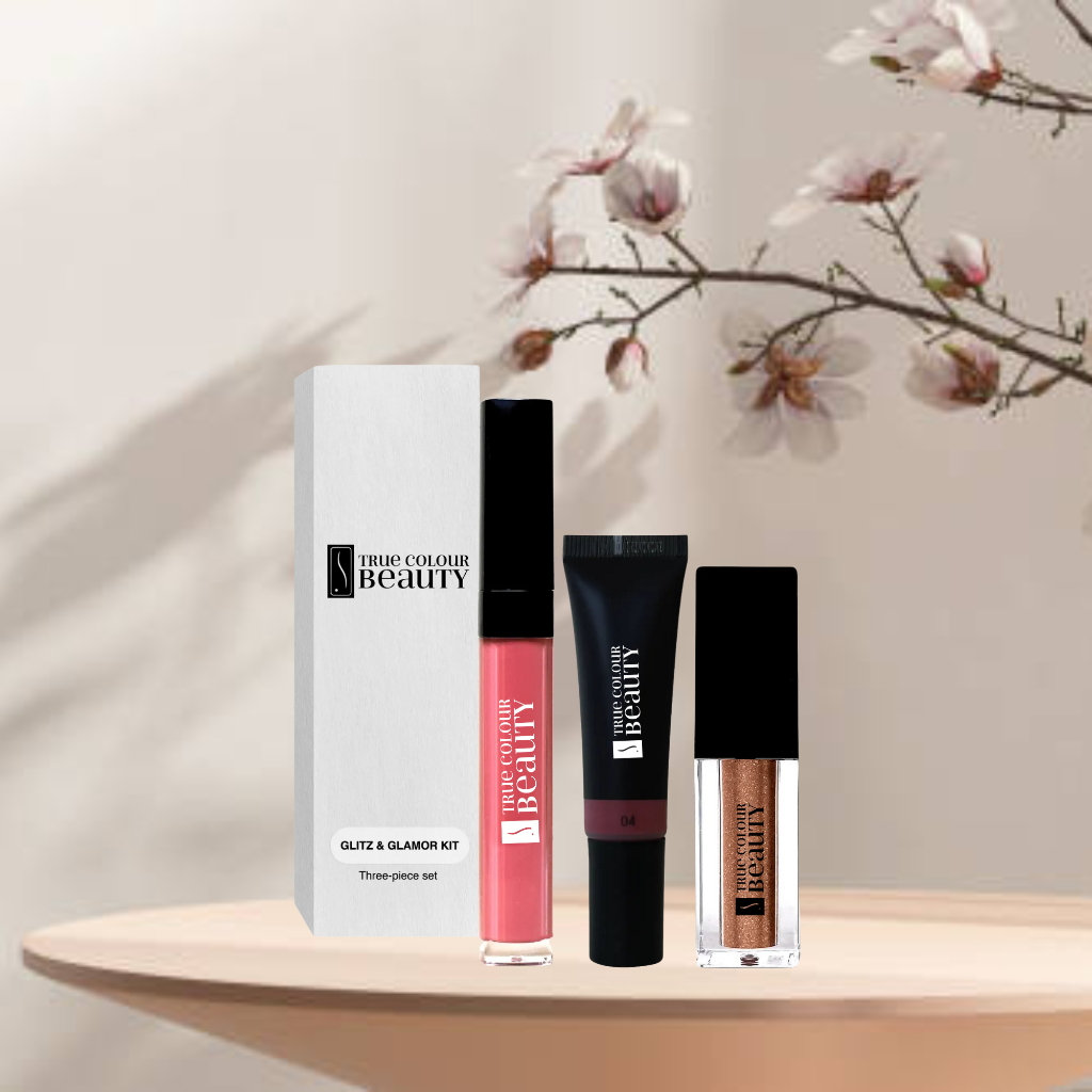 A luxurious makeup set featuring a variety of products, arranged on a table.