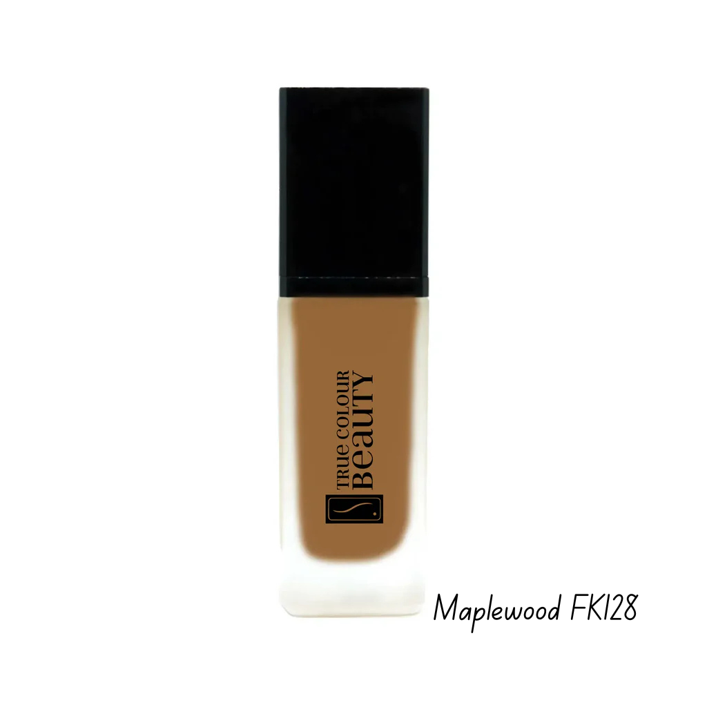 Foundation bottle with black cap and brown body on a white background