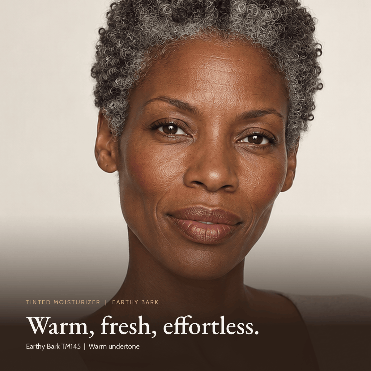 Close-up of model wearing Tinted Moisturizer in Earthy Bark