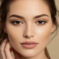 Close-up of a woman's face with a neutral background