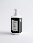 White bottle with black label on a light gray background