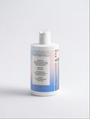 White bottle with a blue label on a light gray background