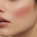 Close-up of a person's face with blush on cheeks
