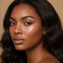 Close-up of a woman with wavy hair against a neutral background