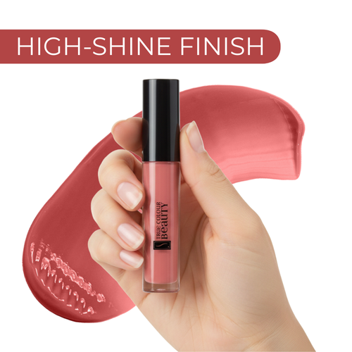 Lip gloss held by a hand with a high-shine finish label and pink swatch in the background