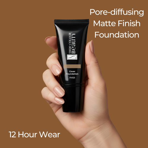Hand holding a black foundation tube with text about pore-diffusing matte finish foundation on a brown background