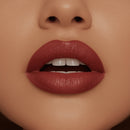 Close-up of a person's lips with a focus on the lipstick color.