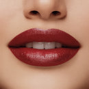 Close-up of a woman's lips with red lipstick on a beige background