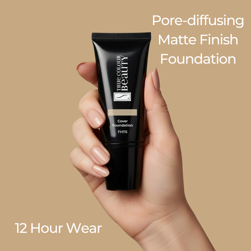 Hand holding a black foundation tube with beige background