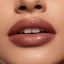 Close-up of a woman's lips with a soft pink lipstick