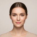 Woman with a neutral expression against a beige background