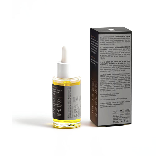 Natural Retinol Alternative Oil Serum bottle beside the back of its box