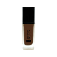 Earthbound Liquid Foundation - Dark Walnut in a sleek bottle, offering medium to full coverage for a glowing complexion, eco-friendly and vegan.