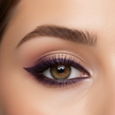Close-up of a woman's eye with purple eyeliner and brown irises.
