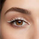 Close-up of a brown eye with white eyeliner