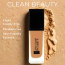 Foundation bottle with 'True Colour Beauty' branding on a beige background, featuring text about product attributes.