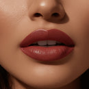 Close-up of a person's lips with a focus on the lipstick color.