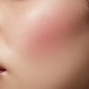 Close-up of a person's neck with a soft focus on skin texture.