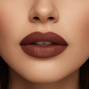Close-up of a woman's lips with a brown lipstick on a neutral background
