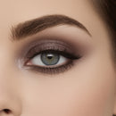 Close-up of a woman's eye with smoky eye makeup