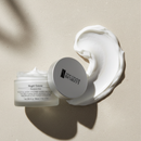 Beauty product with a white container and applicator on a beige background