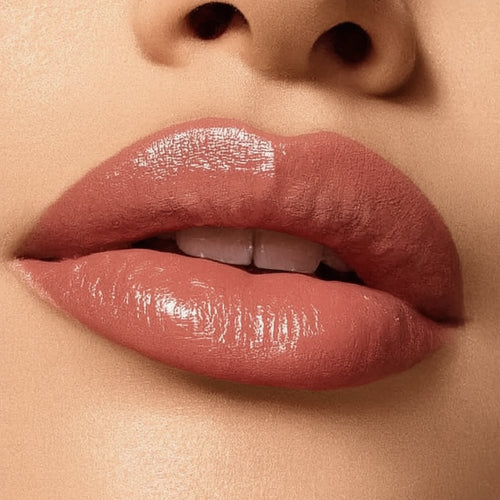 Close-up of a person's lips with a glossy lip color