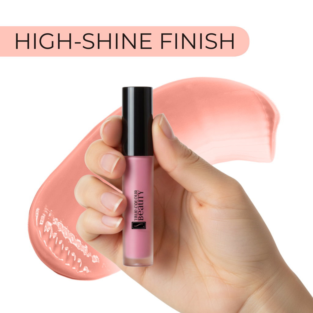 Lip gloss with a high-shine finish, held by a hand against a white background.