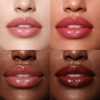 Close-up of lips with different shades of pink and red on a neutral background