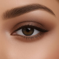 Close-up of a brown eye with detailed makeup on a beige background