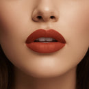 Close-up of a woman's lips with a bold red lipstick