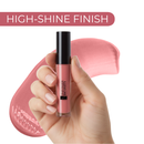 Lip gloss held by a hand with a pink background and 'High-Shine Finish' text.