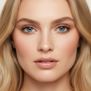 Close-up of a person with blonde hair and blue eyes.