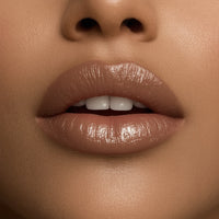 Close-up of a person's lips with a neutral background