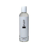 TCB Thermal Heat Shield Serum bottle, formulated to protect hair from heat damage while adding shine and smoothness.