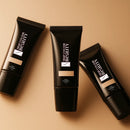 Three tubes of 'The Colour Beauty' foundation on a beige background