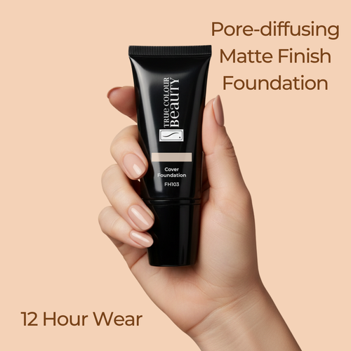 Hand holding a black foundation tube with text about pore-diffusing matte finish foundation on a beige background