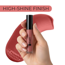 Lip gloss held by a hand with a pink background and 'High-Shine Finish' text.