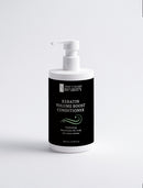 Bottle of Keratin Volume Boost Conditioner with pump on a white background
