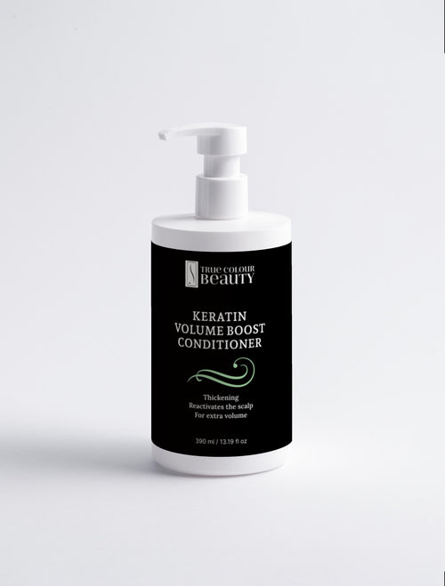 Bottle of Keratin Volume Boost Conditioner with pump on a white background