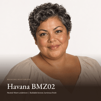 Model wearing Bronzing Moisturizer in Havana