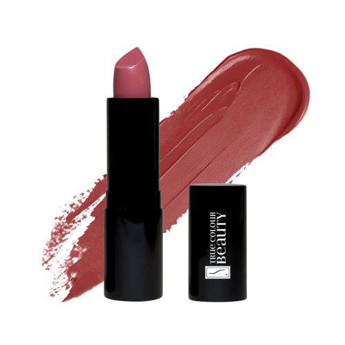 Dreamy Orchid lipstick tube next to a matching swatch of its warm, feminine hue