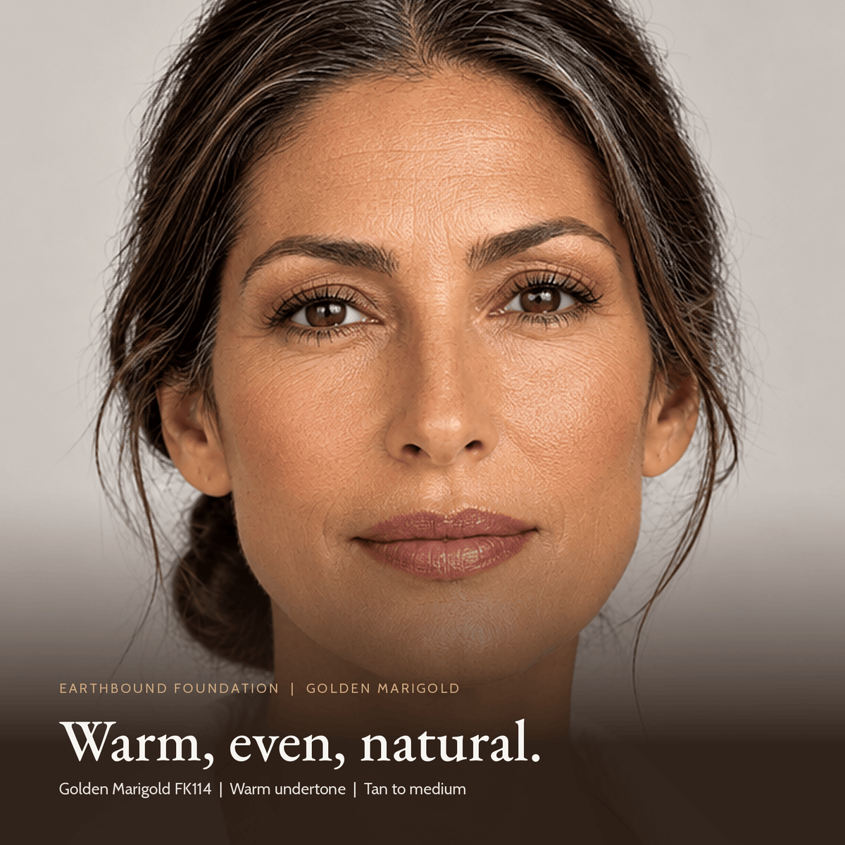 Close-up of model for Earthbound Liquid Foundation in Golden Marigold