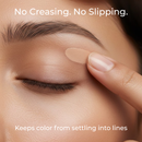 Close-up of a person applying concealer with text 'No Creasing. No Slipping.'