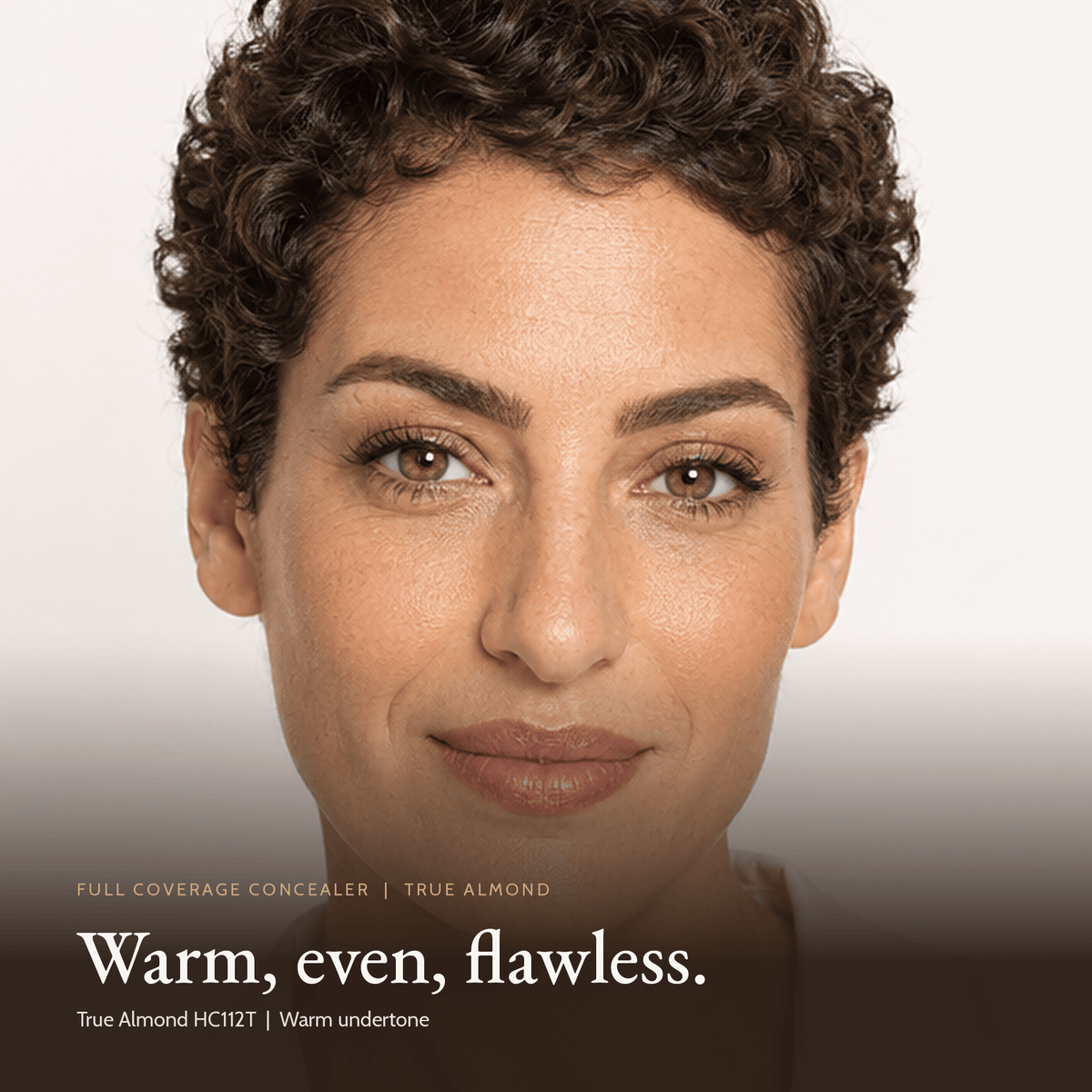 Close-up of model wearing Full Coverage Concealer in True Almond