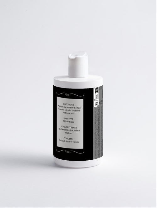 White bottle with a black label on a white background