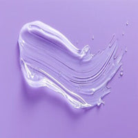 White cream smear on a purple background