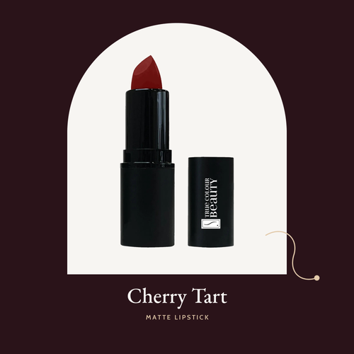 Matte Lipstick in Cherry Tart, a deep cherry red, with its black cap.