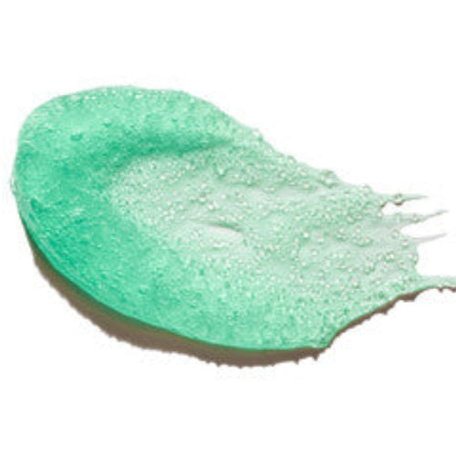 Green lip scrub swatch on a white background