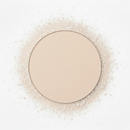 Circular arrangement of beige powder on a white background