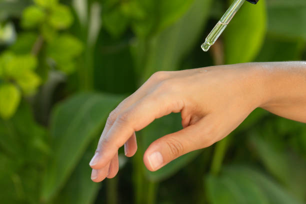 serum dropper with green leaves